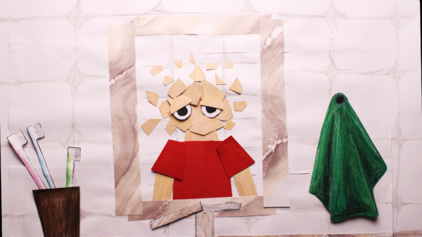 Kadr z filmu animowanego, postać wykonana z papierowych elementów znajduje się w łazience, obok niej widoczna jest zielona, przypominająca ducha forma.