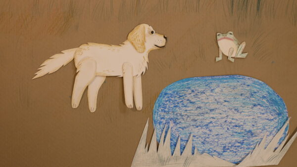 Kadr z filmu animowanego, papierowy pies stoi na brzegu niebieskiego stawu, naprzeciw niego znajduje się mała żaba.